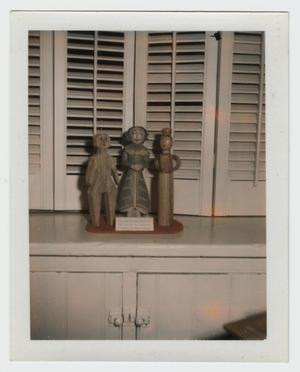 [Photograph of Carved Wooden Dolls]
