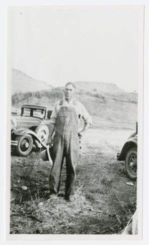 [Photograph of a Man with Cars]