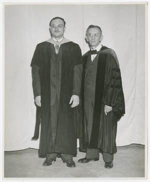 [Lutheran Concordia College President Henry Studtmann with man in graduation robe]