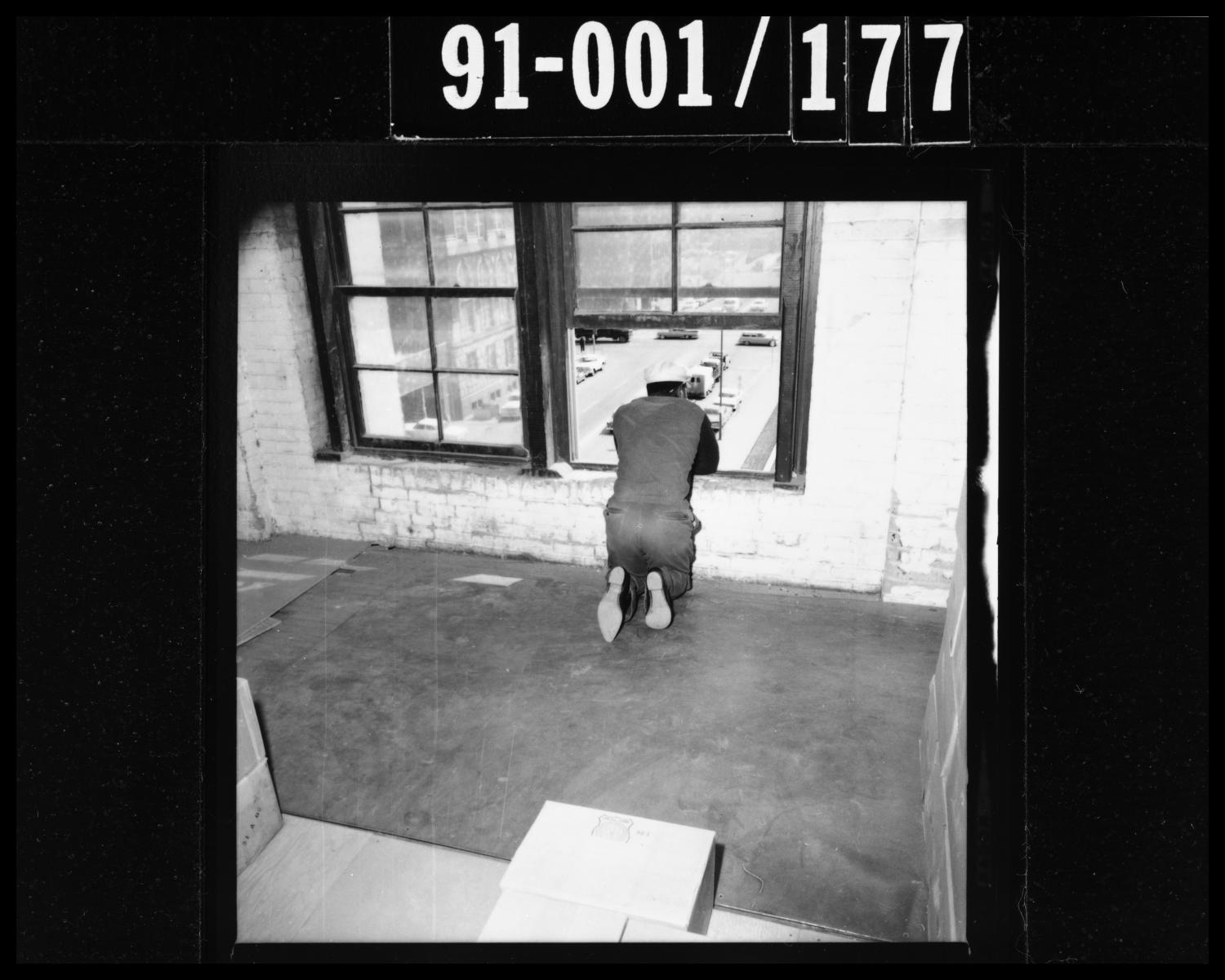 Man Looking Out of Window in the Texas School Book Depository - Side 1