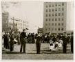 Photograph: Band Members and Dance Routine Performing in Front of Sykes Pharmacy