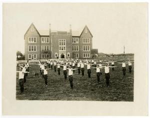 Primary view of object titled '1923-'24 Group Training Exercises in the Quad with Dog'.