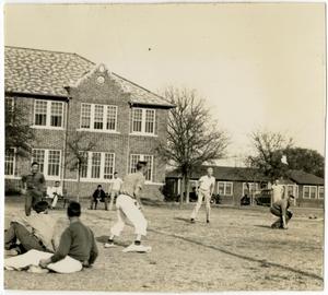 Young Men in a Football Play with Others Watching