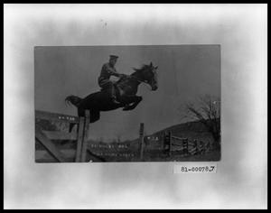 Primary view of object titled 'Cavalry Rider Jumping Barbwire Fence'.