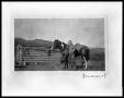Photograph: Man with Horse by Cabin