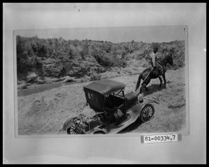 Primary view of object titled 'Man On Horseback Pulling Car'.