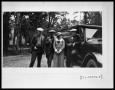 Photograph: Three Men with Woman by Car