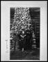Thumbnail image of item number 1 in: 'Two Men with Woman in Front of Stone Chimney on Cabin'.