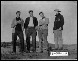 Four Young Men Posing Outside