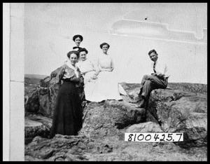 Four Women and One Man Outside on Rocks
