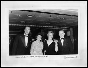Two Men and Two Women Dressed up on Board RMS. Queen Elizabeth