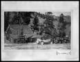 Photograph: House and Cars by Trees and Mountain