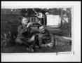 Photograph: Two Soldiers Relaxing by a Stone Wall