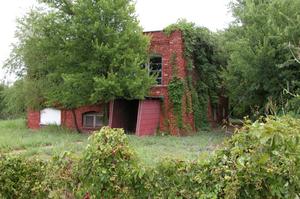 Primary view of object titled 'Red Brick Abandoned Building in Thurber, Texas'.