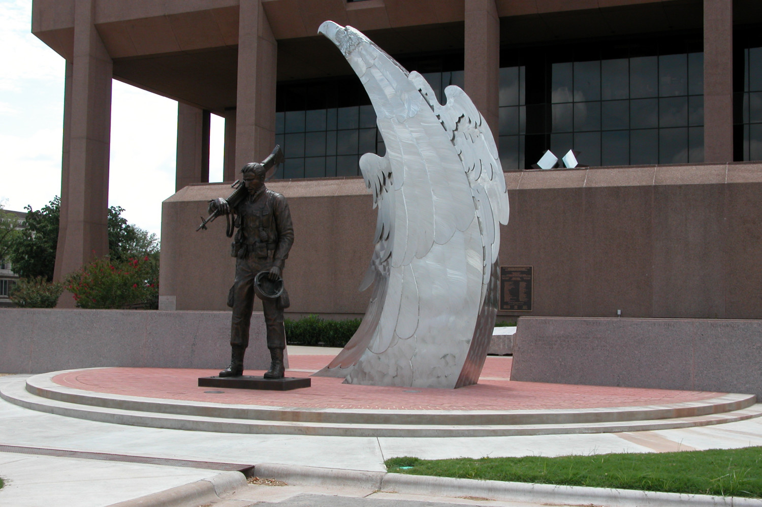 Taylor County Veterans Memorial and Plaza, featuring a bronze soldier and silver eagle sculptures.
                                                
                                                    [Sequence #]: 1 of 1
                                                