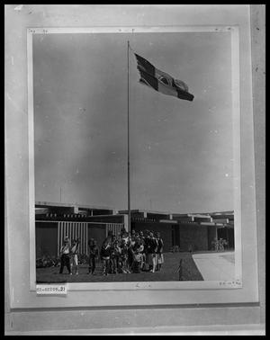 Students Standing Under Flag