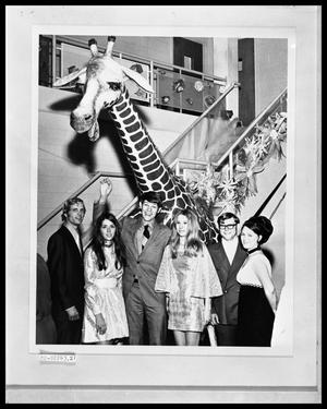 Primary view of object titled 'Six People By Giraffe'.
