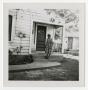 Thumbnail image of item number 1 in: '[S. A. Winn Standing on a Porch]'.