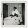 Thumbnail image of item number 1 in: '[Woman Folding Sheets]'.