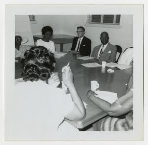 Primary view of object titled '[Group of Men and Women at a Meeting]'.