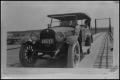 Thumbnail image of item number 1 in: '[Photograph of a Car on a Bridge]'.