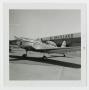 Thumbnail image of item number 1 in: '[Airplane in Front of Hangar]'.