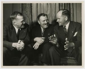 [Photograph of Men on Couch]