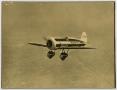 Thumbnail image of item number 1 in: '[Photograph of a Plane in Flight]'.