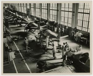 [Photograph of Airplane Assembly Line]