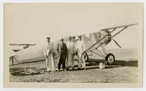 [Four Men in Front of Airplane]