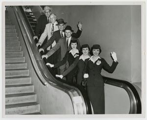 [Group on Escalator]