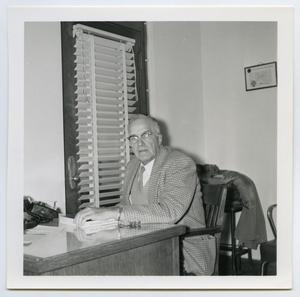 Primary view of object titled '[William G. Fuller Sitting at Desk]'.