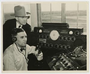 Primary view of object titled '[Two Men in Control Tower]'.