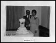 Photograph: Couple by Anniversary Cake