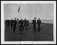 Photograph: Man with Navy Officers on Ship