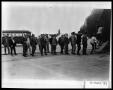 Thumbnail image of item number 1 in: 'Men Boarding Plane'.