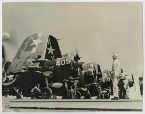 [Photograph of F4U-2 Corsairs on an unknown ship]