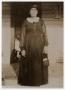 Photograph: [Photograph of Laura Courtney by a Doorway]
