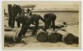 Photograph: [Photograph of Men Loading 14" Artillery Shells]