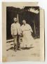 Primary view of [Abner and Sarah Davis Standing by a House]