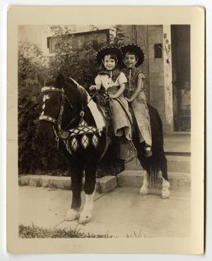 Primary view of object titled '[Judy Helton and Mary Newton Riding a Pony]'.