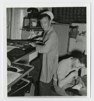 Primary view of object titled '[Photograph of R. W. Coyne in U.S.S. Texas Navigation Office]'.