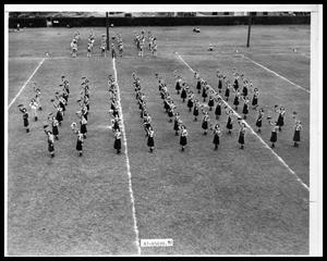 Primary view of object titled 'HSU Cowgirls with Cowboy Band on Field'.