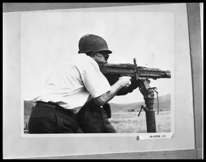 Primary view of object titled 'Man Firing Machine Gun'.