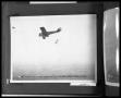 Photograph: Man Jumping from Bi-Plane
