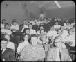 Photograph: [Men and Women Sitting in Classroom]