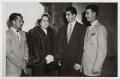 Photograph: [Photograph of a Woman with Men]