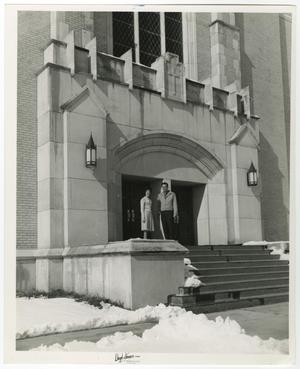 [Photograph of Two Students Standing in Front of Radford Hall]