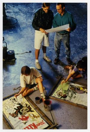 [Photograph of Students Painting Movie Signs]
