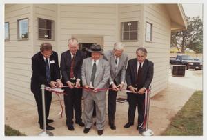 Primary view of object titled '[Photograph of Ribbon Cutting for Student Apartments]'.
